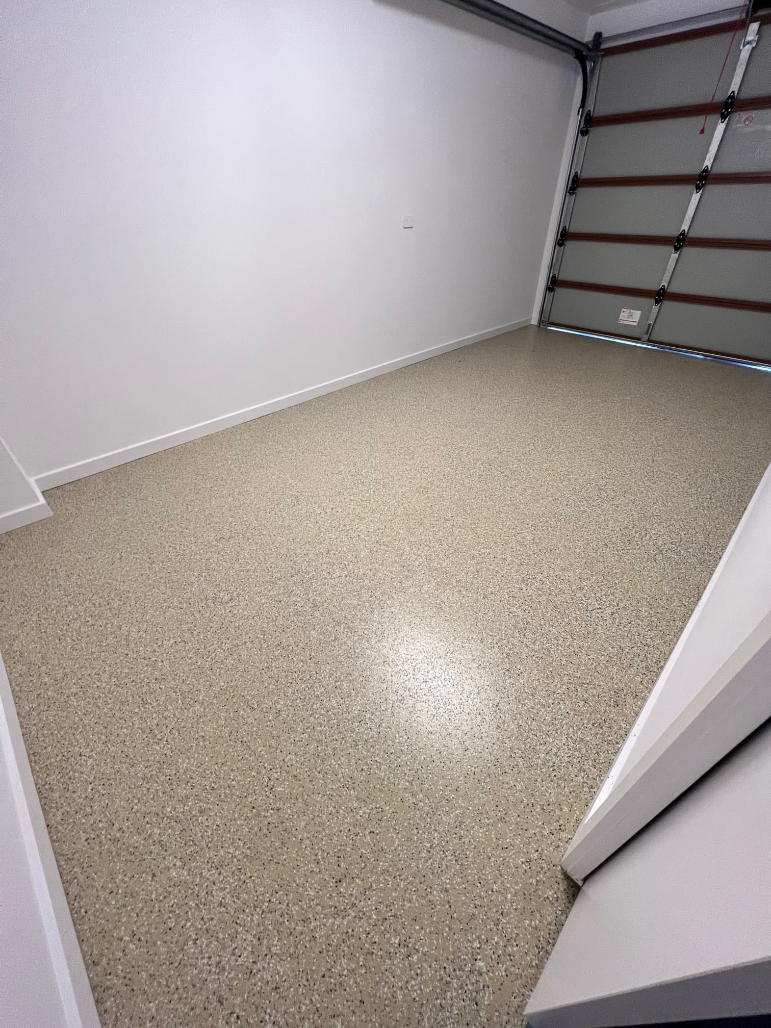 Flaked epoxy garage floor in Adelaide